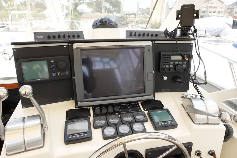 Slide: The Image of Control panel of a 2002 Carolina Classic 35 boat with navigation equipment. - 26