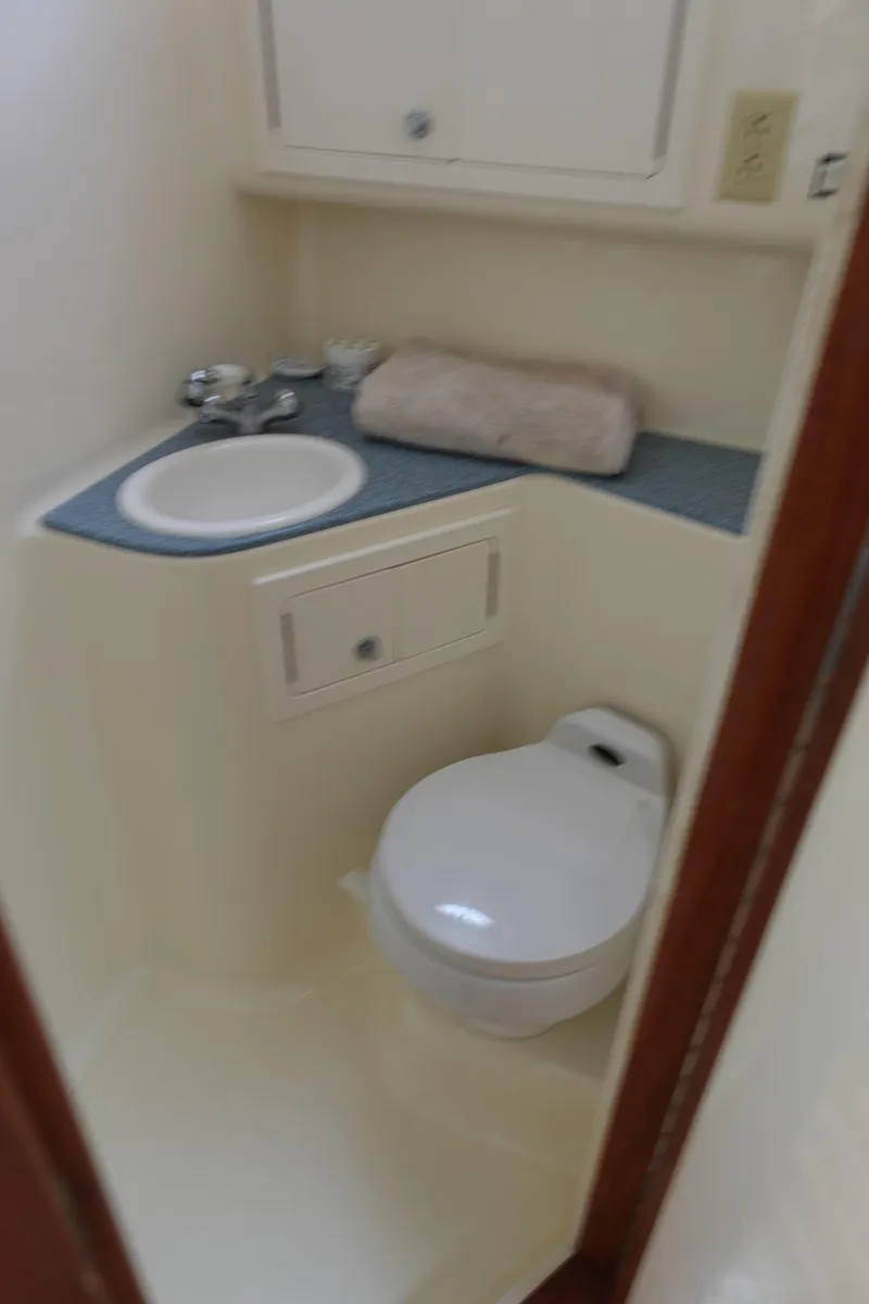 Slide: The Image of 2002 Carolina Classic 35 boat bathroom with sink and toilet. - 39