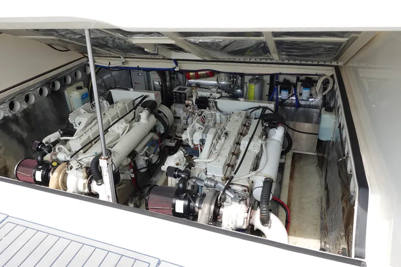 Slide: The Image of Engine room of a 2002 Carolina Classic 35 boat, showcasing dual engines. - 40