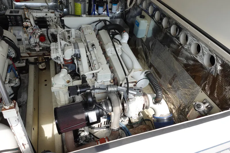 Slide: The Image of Engine room of 2002 Carolina Classic 35 boat, showcasing detailed mechanical components. - 42