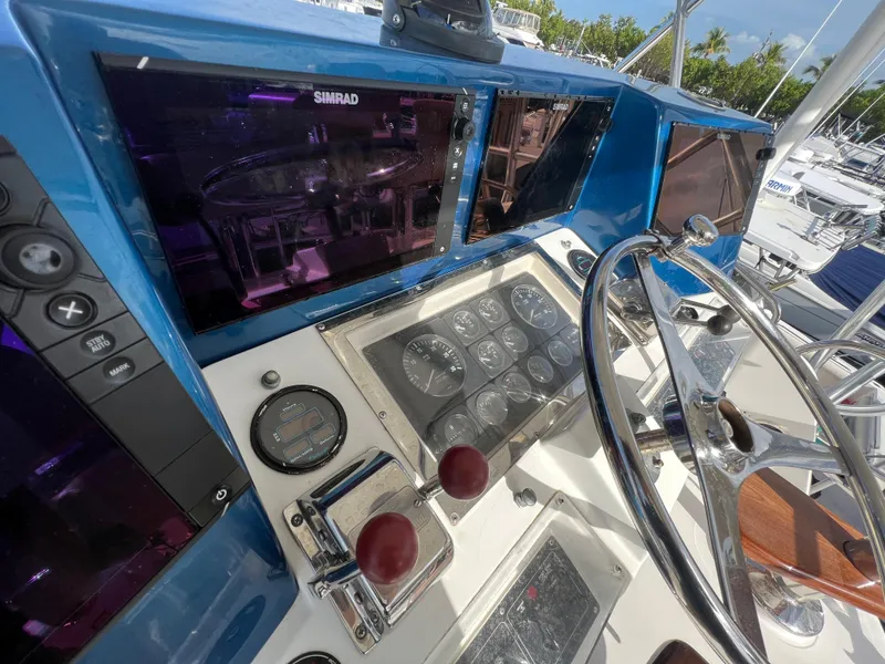 Slide: The Image of Control panel of a 2000 Cabo 35 Flybridge Sportfisher boat. - 24