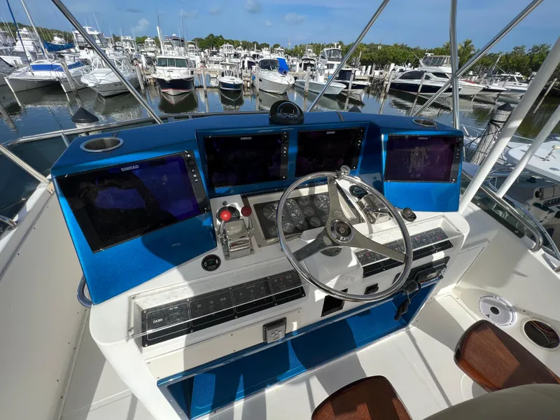 Slide: The Image of Control panel of a 2000 Cabo 35 Flybridge Sportfisher at a marina. - 25