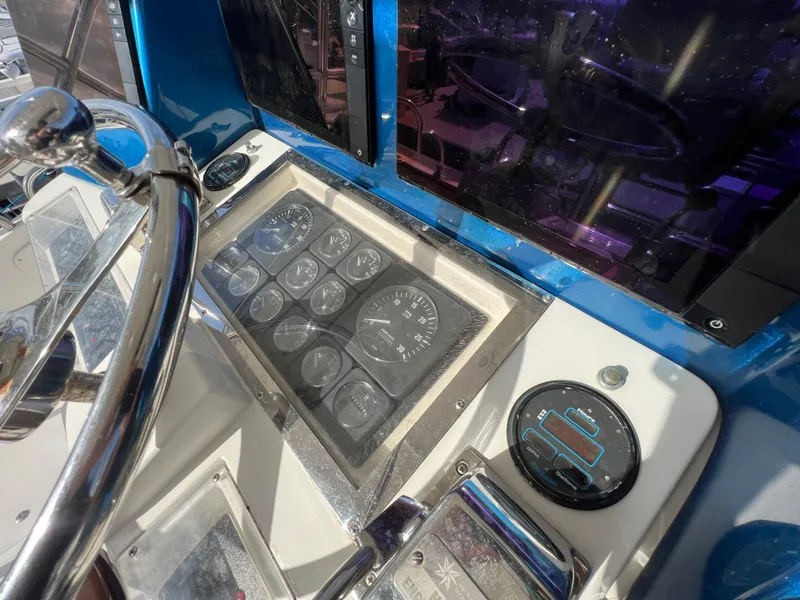 Slide: The Image of Control panel of a 2000 Cabo 35 Flybridge Sportfisher boat. - 31