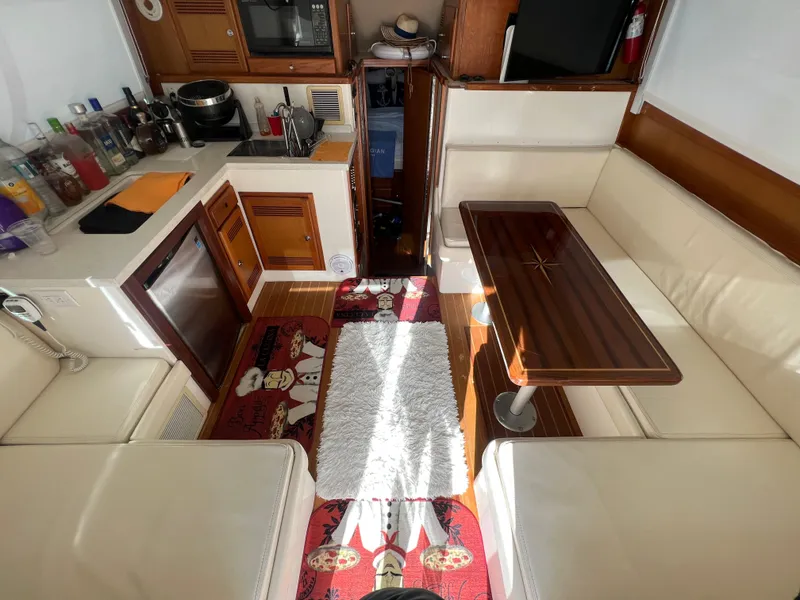 Slide: The Image of Interior of 2000 Cabo 35 Flybridge Sportfisher with kitchen and dining area. - 33