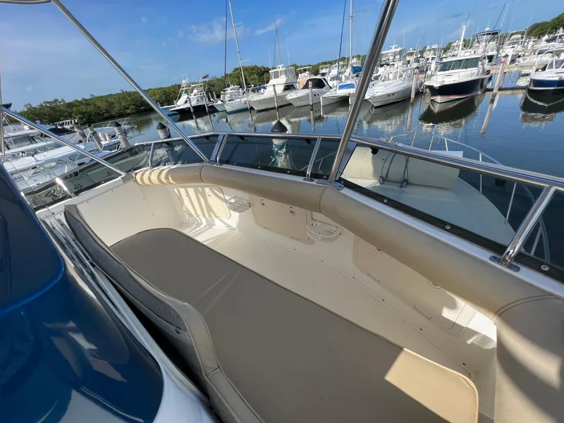 Slide: The Image of 2000 Cabo 35 Flybridge Sportfisher at marina, spacious deck view. - 35