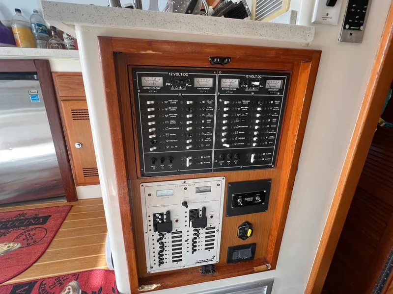 Slide: The Image of Electrical control panel on a 2000 Cabo 35 Flybridge Sportfisher boat. - 41