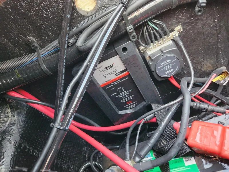 Slide: The Image of 2022 Stingray 231 DC boat wiring with ProMariner ProNautic charger and digital circuit breaker. - 23