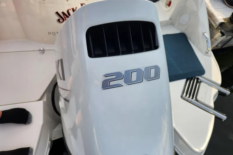 Slide: The Image of Outboard motor on 2022 Stingray 231 DC boat, featuring a 200 horsepower engine. - 9