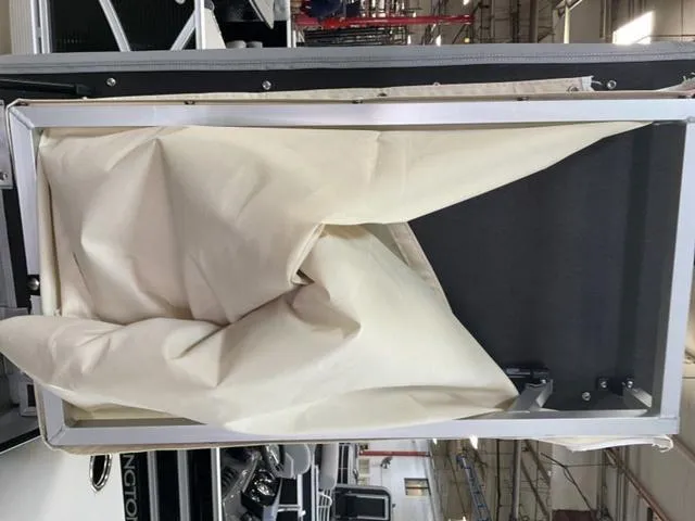 Slide: The Image of 2025 Bennington 20 SVL boat interior with folded beige fabric cover. - 10