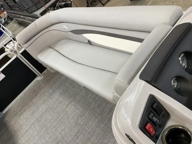 Slide: The Image of 2025 Bennington 20 SVL boat interior with sleek seating and modern controls. - 14