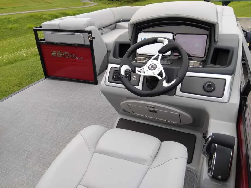 Slide: The Image of 2024 Regency 250 DL3 boat interior with modern steering console and seating. - 3