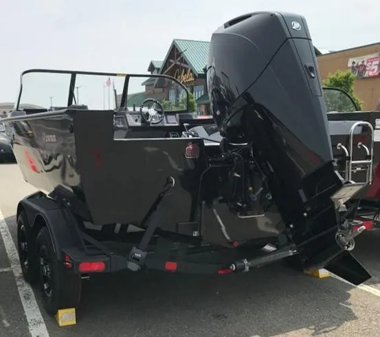 Slide: The Image of 2023 Ranger VX1888 WT boat with outboard motor in parking lot. - 2