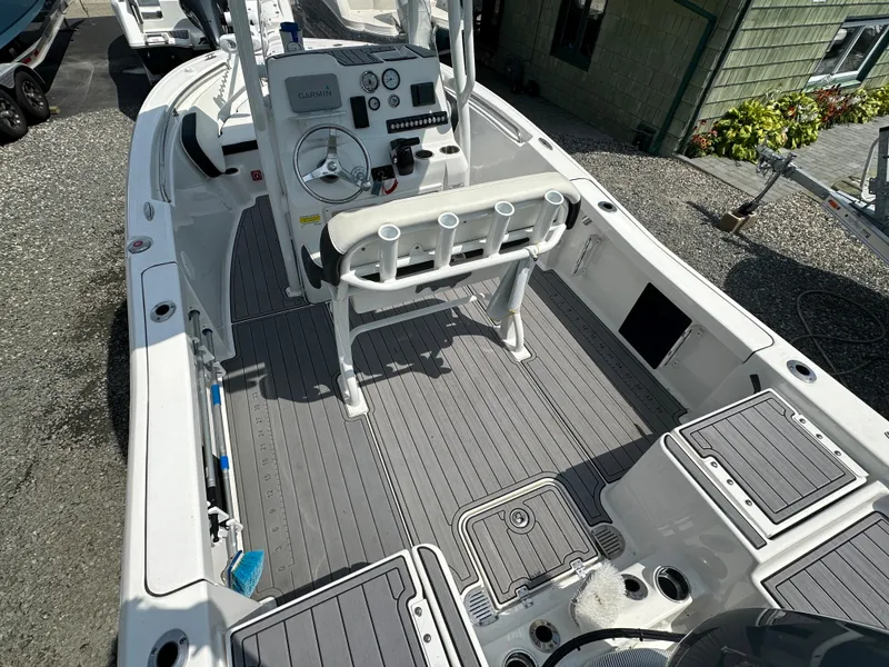 Slide: The Image of 2022 Tidewater 198 CC boat interior with console and seating. - 3