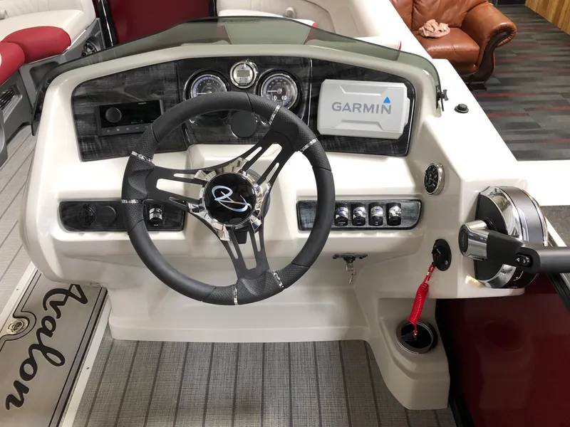 Slide: The Image of 2023 Avalon LSZ 2385 Cruise Rear Bench dashboard with Garmin navigation system. - 11