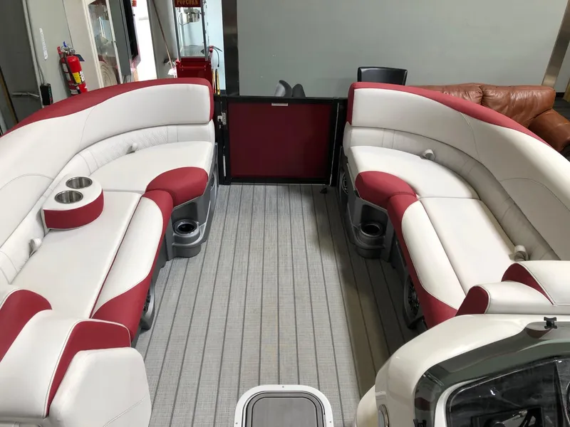 Slide: The Image of 2023 Avalon LSZ 2385 Cruise Rear Bench with red and white seating on a pontoon boat. - 13