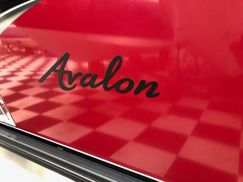Slide: The Image of Red Avalon LSZ 2385 Cruise Rear Bench 2023 with checkered floor reflection. - 3