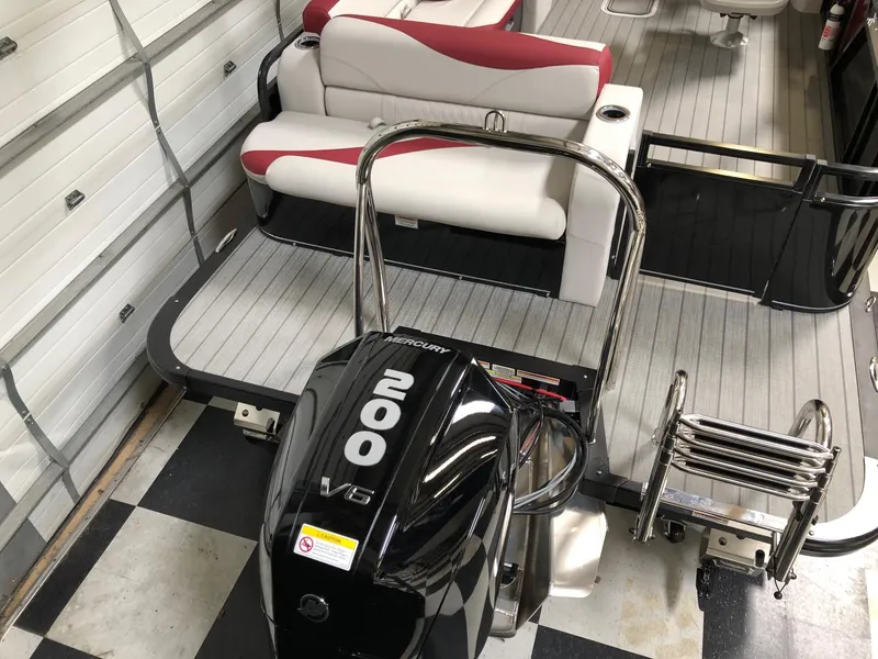 Slide: The Image of 2023 Avalon LSZ 2385 Cruise Rear Bench with Mercury 200 V6 engine in a garage. - 6