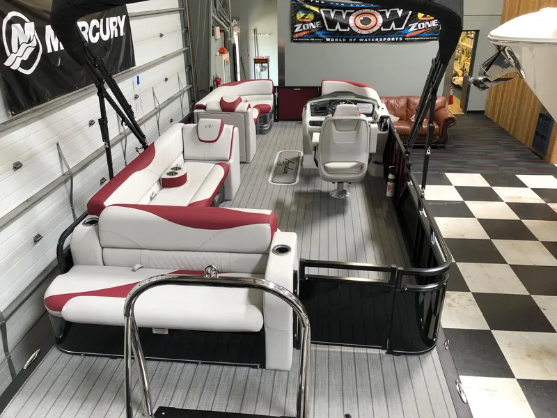 Slide: The Image of 2023 Avalon LSZ 2385 Cruise Rear Bench pontoon boat with stylish seating in showroom. - 7