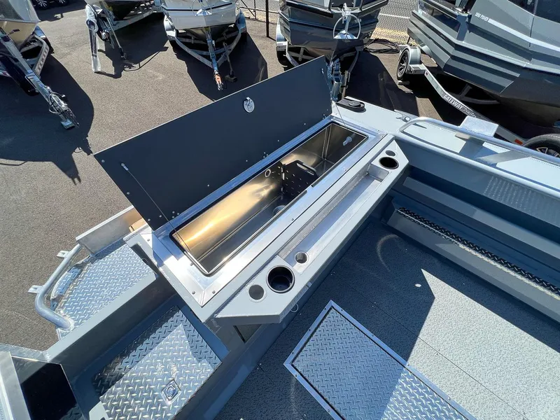 Slide: The Image of 2023 Hewescraft 240 Ocean Pro HT boat interior with open storage compartment. - 17