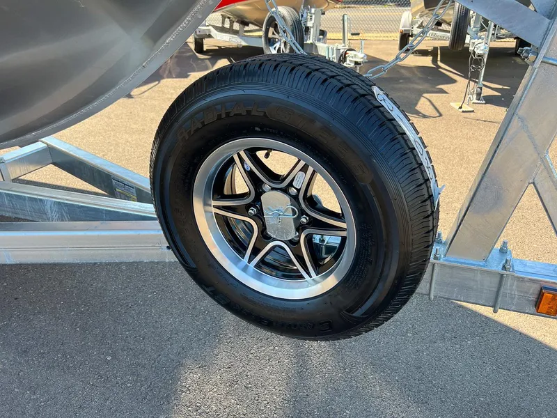 Slide: The Image of Close-up of a 2023 Hewescraft 240 Ocean Pro HT trailer wheel. - 22