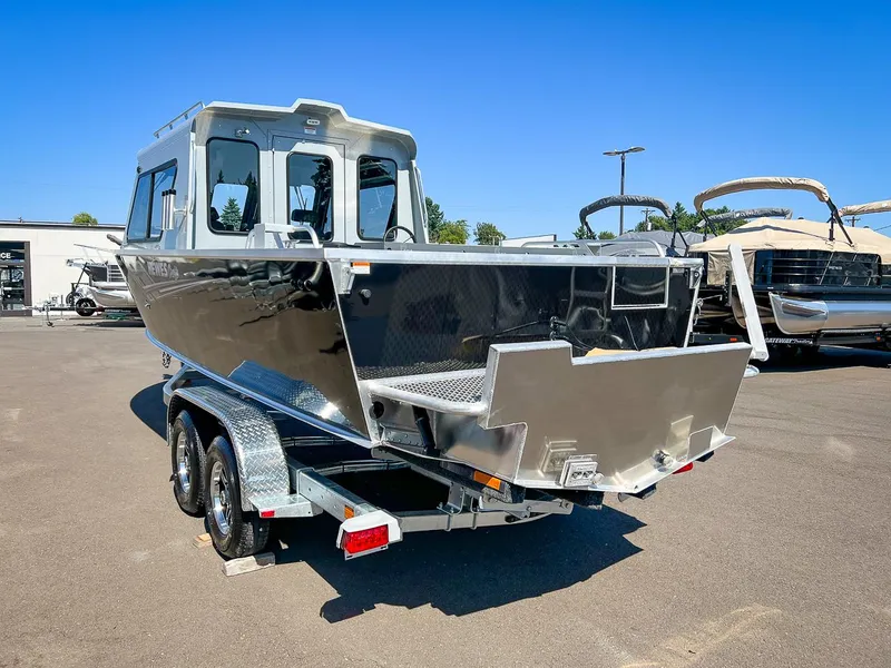 Slide: The Image of 2023 Hewescraft 240 Ocean Pro HT boat on trailer in outdoor lot. - 5