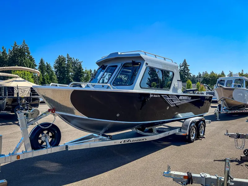 Slide: The Image of 2023 Hewescraft 240 Ocean Pro HT boat on trailer in outdoor lot. - 6