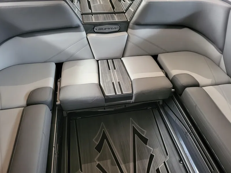 Slide: The Image of 2024 Supra SL interior with sleek gray seating and modern design. - 12