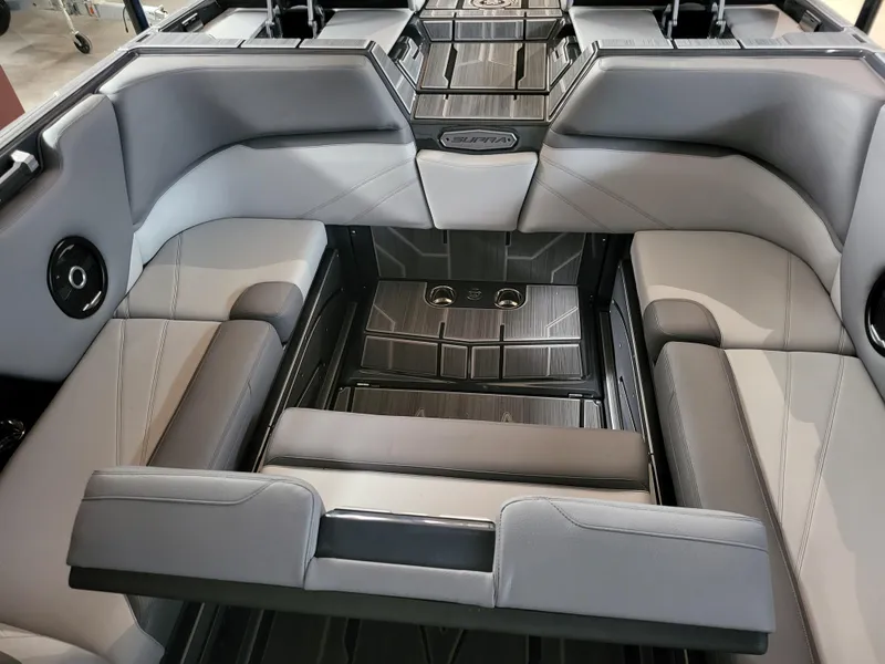Slide: The Image of 2024 Supra SL boat interior with sleek gray seating and modern design. - 14