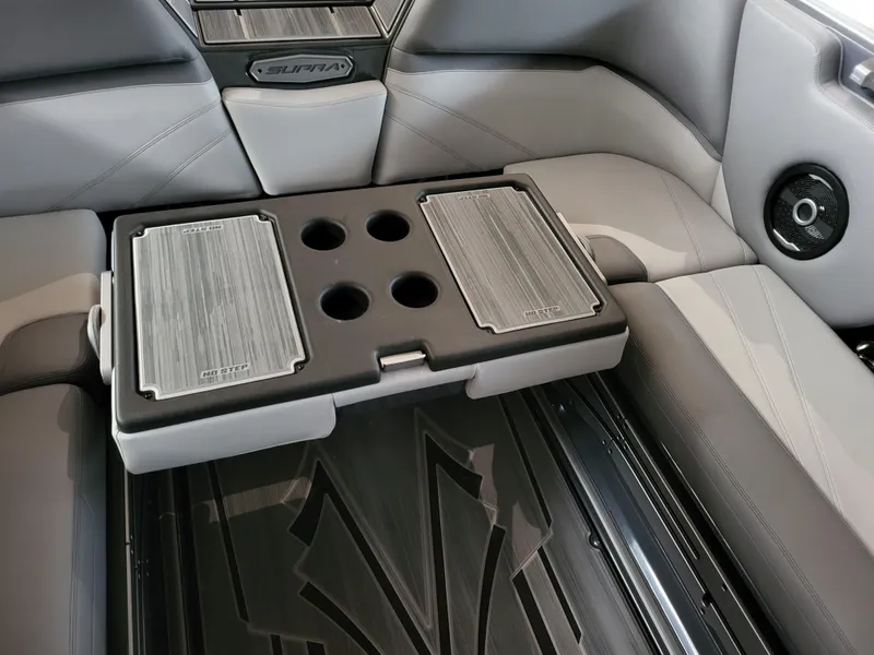 Slide: The Image of 2024 Supra SL interior with foldable table and cup holders, featuring sleek design and modern amenities. - 15