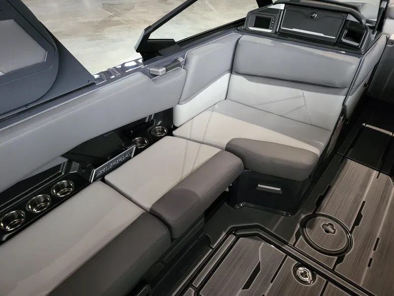 Slide: The Image of 2024 Supra SL interior with sleek gray seating and modern design. - 17