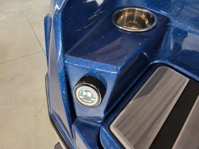 Slide: The Image of 2024 Supra SL boat detail with blue metallic finish and control panel. - 9