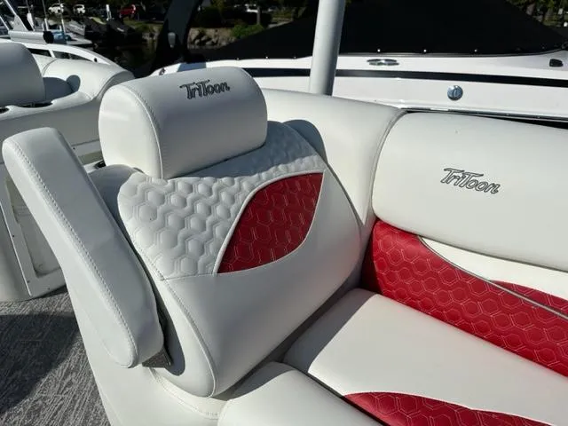 Slide: The Image of Luxury seating on the 2023 JC SportToon 24 TT boat with Triton branding. - 21