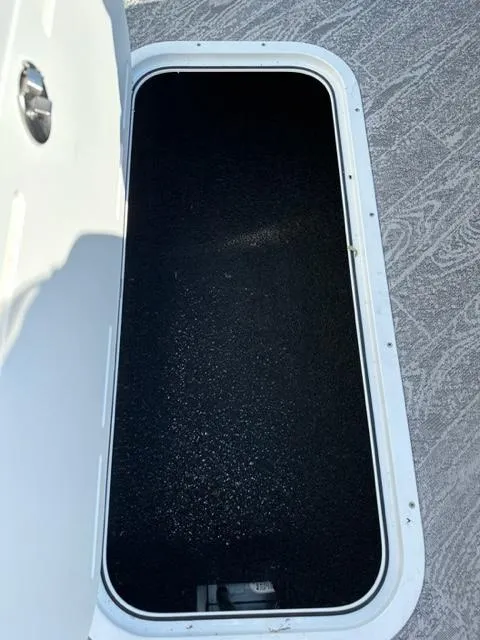 Slide: The Image of Open storage compartment on 2023 JC SportToon 24 TT boat. - 30