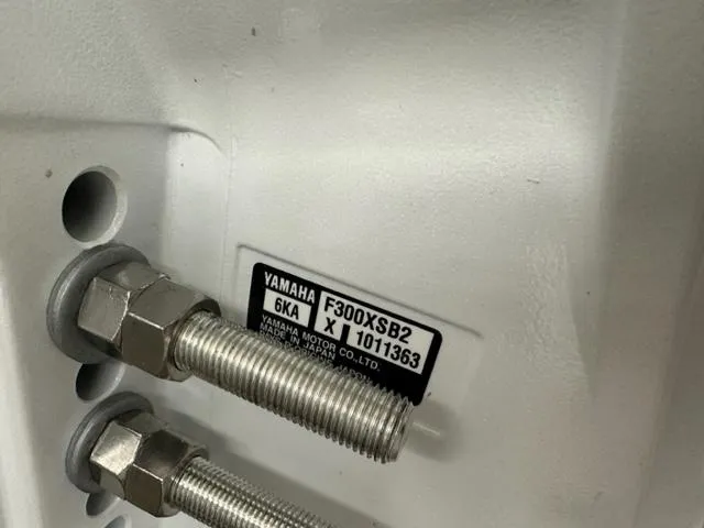 Slide: The Image of Close-up of Yamaha F300XSB2 engine bolts on 2023 JC SportToon 24 TT. - 34