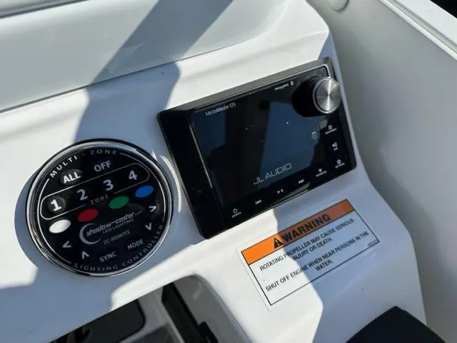 Slide: The Image of Control panel of 2023 JC SportToon 24 TT boat with JL Audio system. - 12