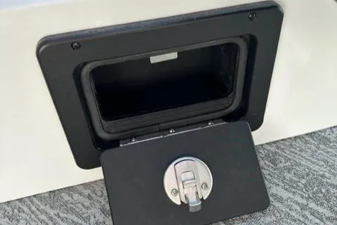 Slide: The Image of 2023 JC SportToon 24 TT storage compartment with latch. - 14