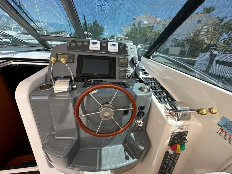 Slide: The Image of Helm of 2004 Tiara Yachts 3600 Sovran with modern navigation equipment. - 10