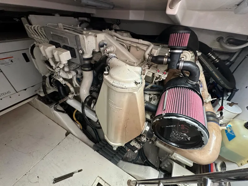 Slide: The Image of 2004 Tiara Yachts 3600 Sovran engine compartment with detailed view of the engine. - 16