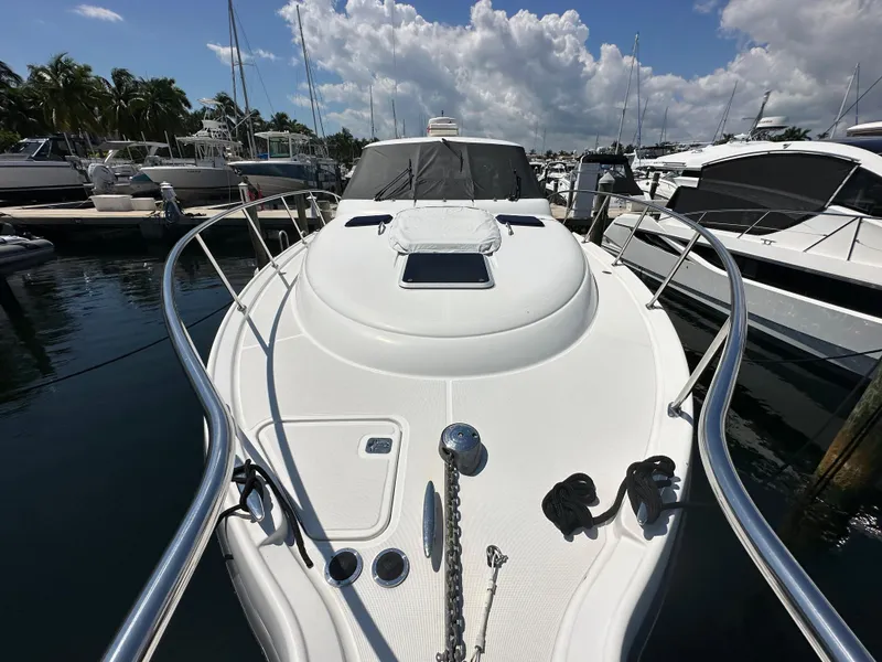 Slide: The Image of 2004 Tiara Yachts 3600 Sovran docked at marina, front deck view. - 20
