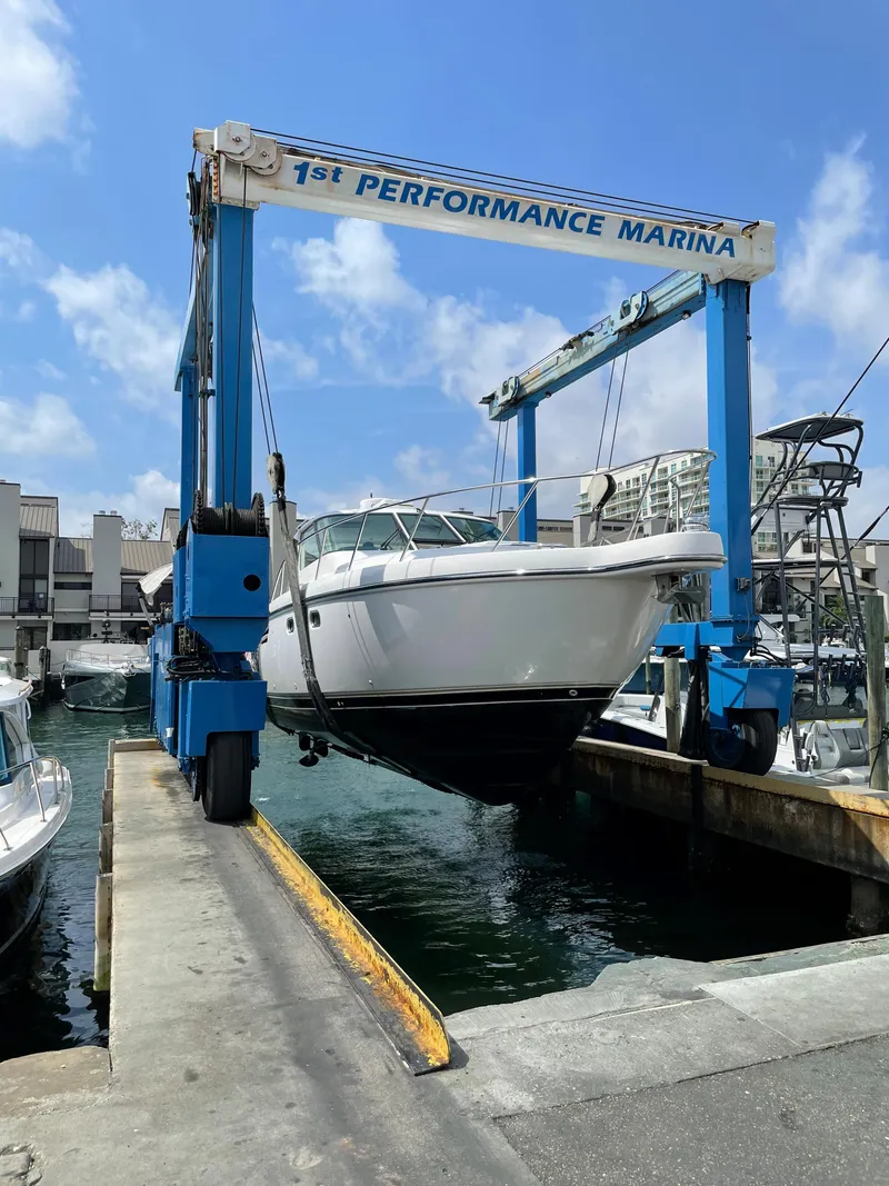 Slide: The Image of 2004 Tiara Yachts 3600 Sovran being lifted at 1st Performance Marina. - 25