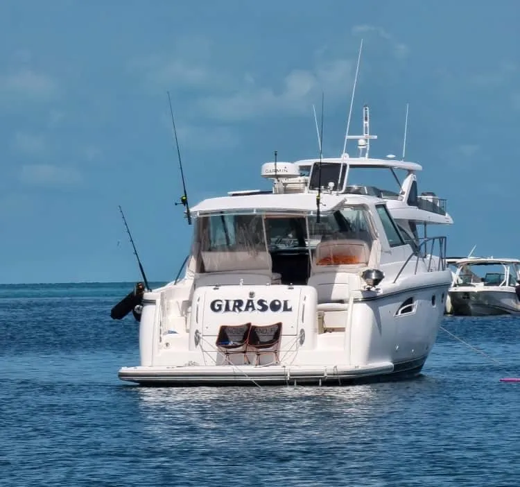 Slide: The Image of 2004 Tiara Yachts 3600 Sovran named Girasol anchored in clear blue waters. - 26