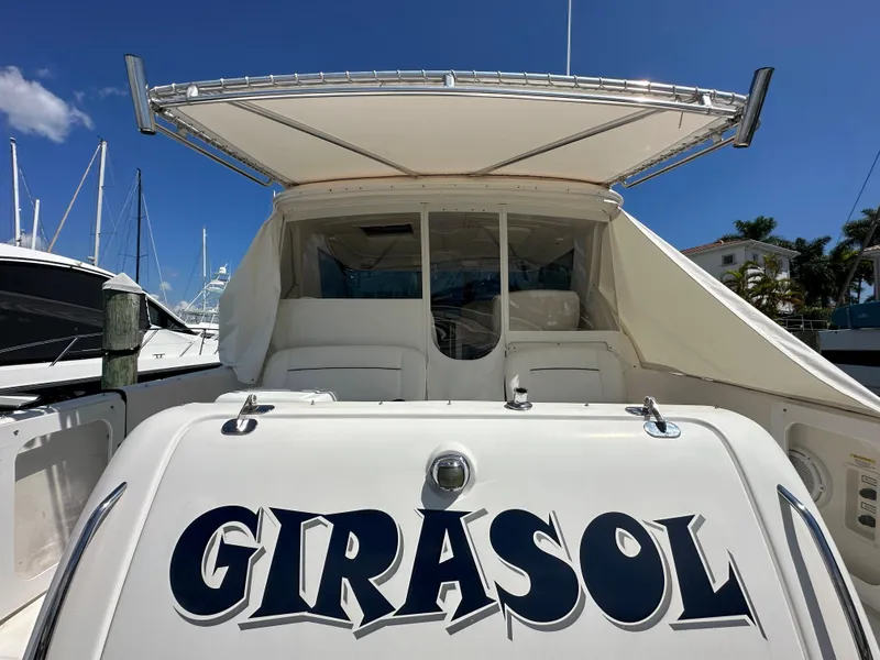 Slide: The Image of 2004 Tiara Yachts 3600 Sovran named Girasol docked at a marina. - 3