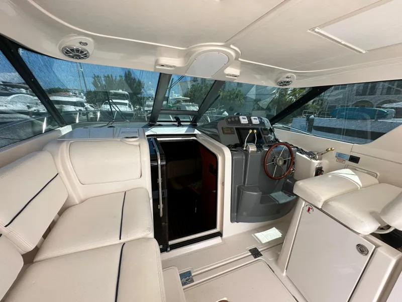 Slide: The Image of Interior of 2004 Tiara Yachts 3600 Sovran with helm and seating area. - 9