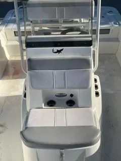 Slide: The Image of 2023 Mako Pro Skiff 19 CC boat interior with seating and console. - 4