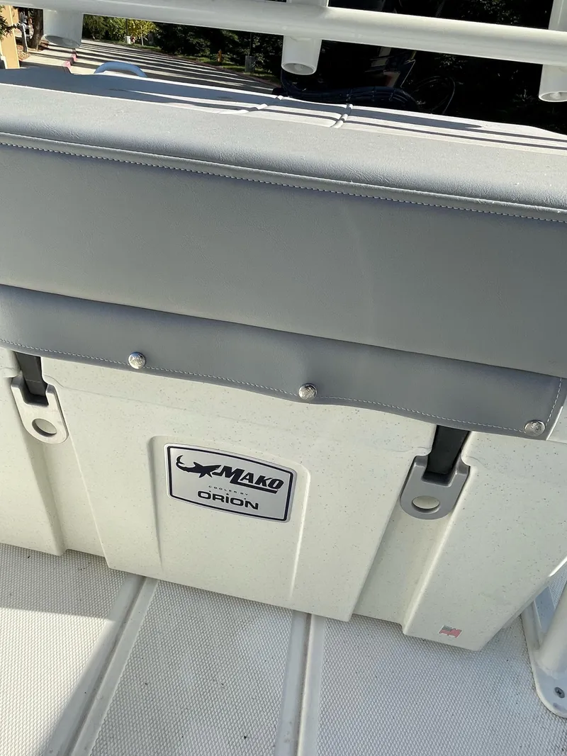 Slide: The Image of 2023 Mako Pro Skiff 19 CC boat seat with storage compartment. - 8