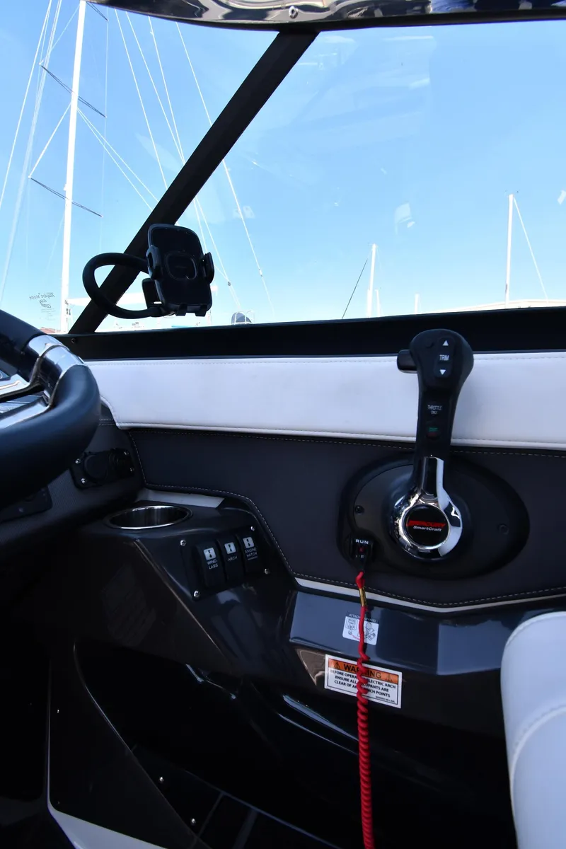 Slide: The Image of Interior cockpit of a 2021 Monterey 278 Super Sport boat with control panel. - 19