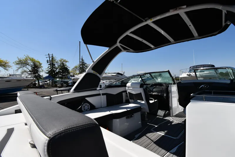Slide: The Image of 2021 Monterey 278 Super Sport boat interior with seating and canopy. - 26