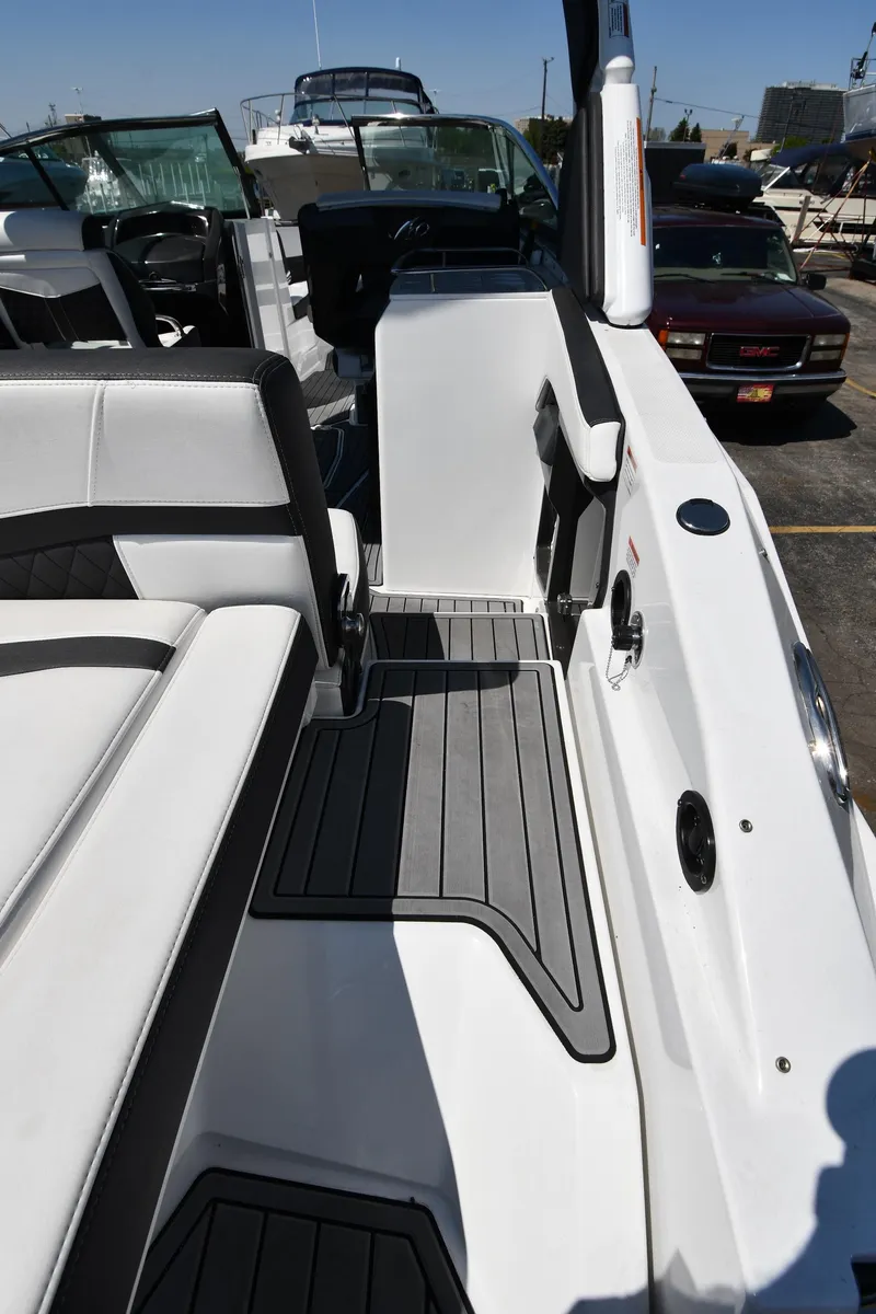 Slide: The Image of 2021 Monterey 278 Super Sport boat interior with seating and deck view. - 30