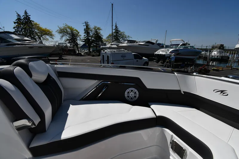 Slide: The Image of 2021 Monterey 278 Super Sport boat interior with white and black seating. - 38