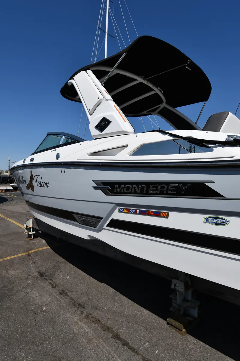 Slide: The Image of 2021 Monterey 278 Super Sport boat docked at a marina. - 4